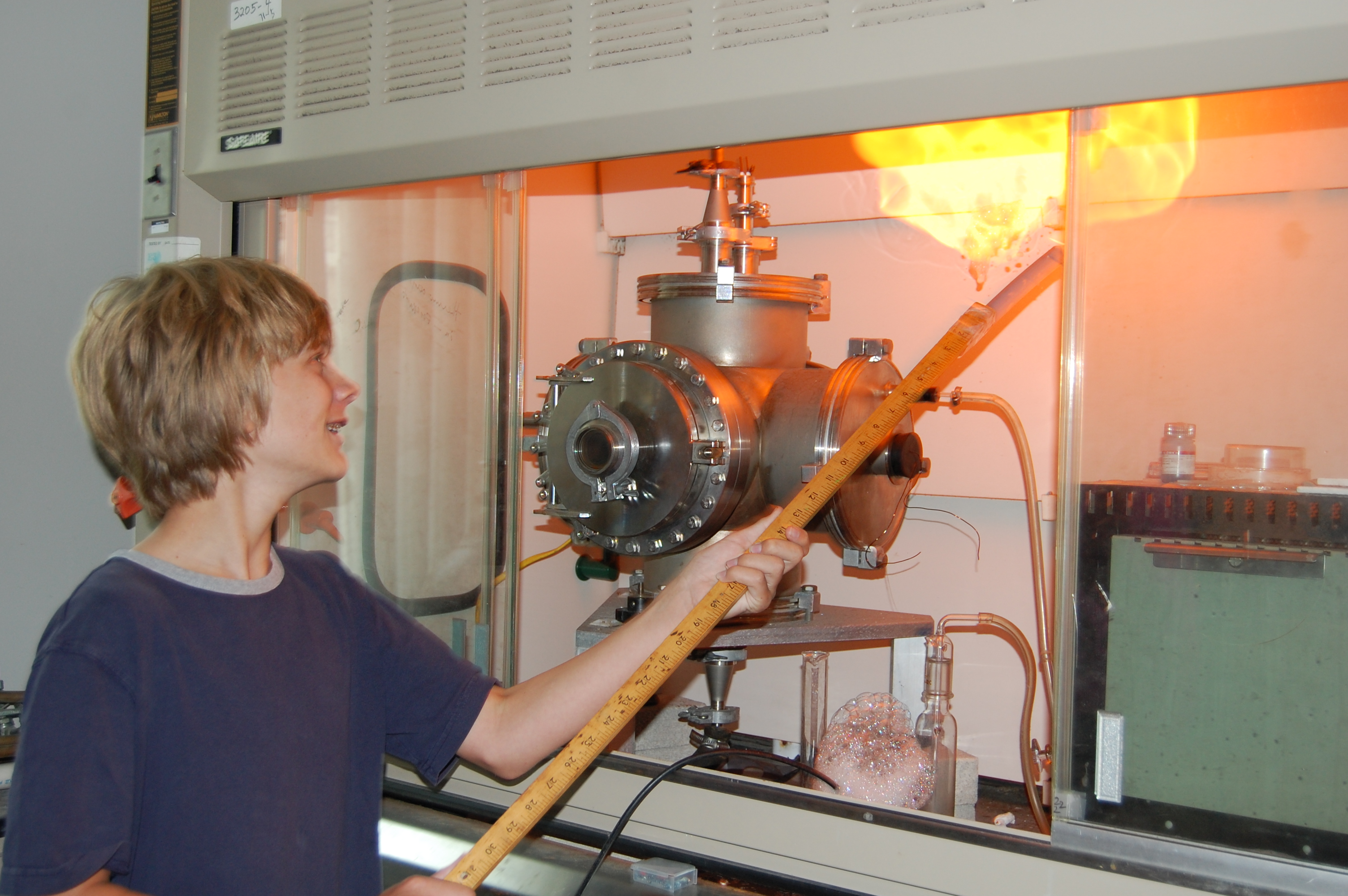 Student setting Hydrogen-gas on fire