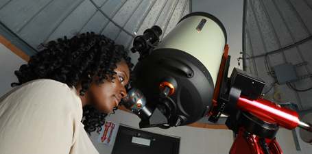 Student using telescope