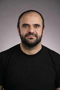 Sonmez Sahutoglu headshot