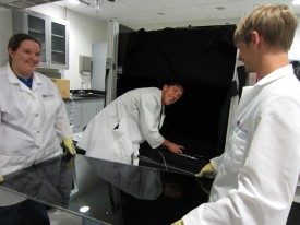 Graduate students working the lab