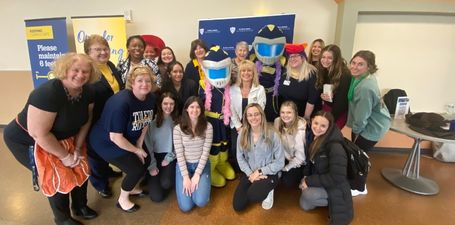 Alumni, faculty, and students at an event