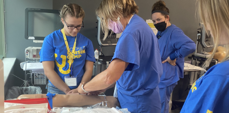 Students learning from registered nurses