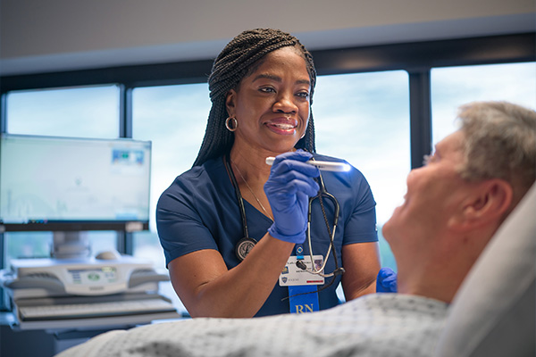 a doctor examaning a patient's eyes