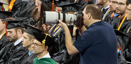 Dan Miller photographing commencement