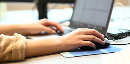 Marketer using a laptop computer