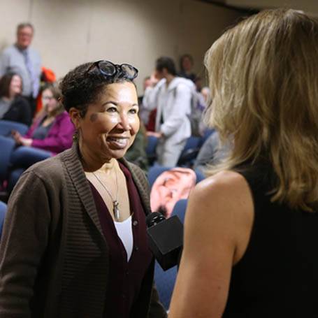 Dr. Celia Williamson being interviewed by a local TV station reporter