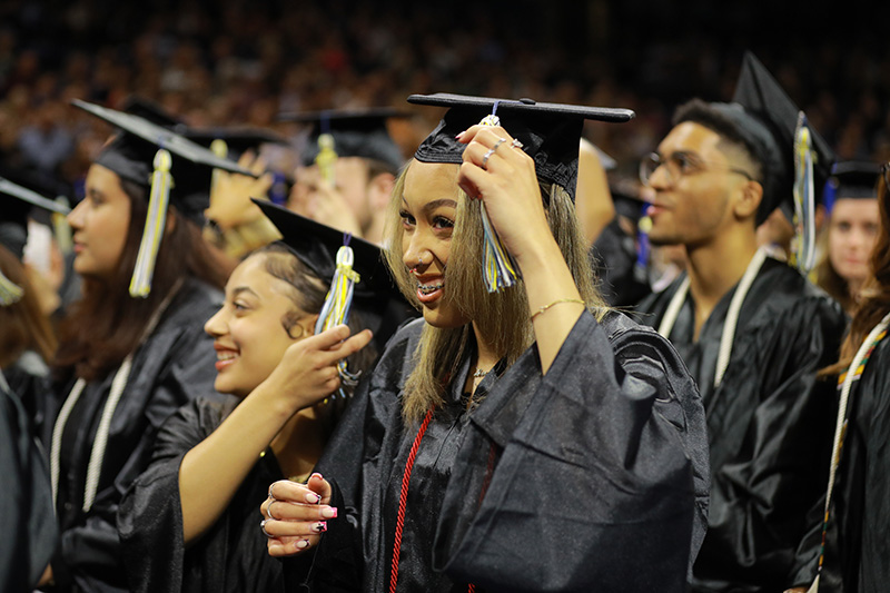 students turning their tassels at commencement