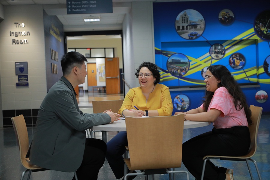 staff talking at table
