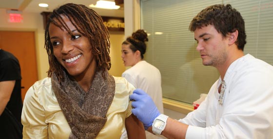 An employee receiving a flu shot