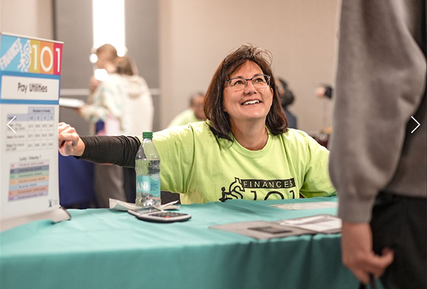 female at information session about preparing to pay for college