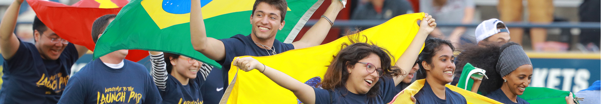 Students carrying international flags