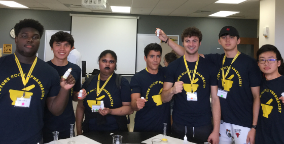 Campers with hand lotions they made in the lab