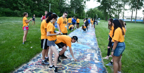 group doing art on campus