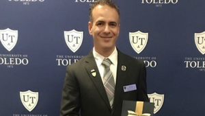 Dr. AbouAlaiwi with his award