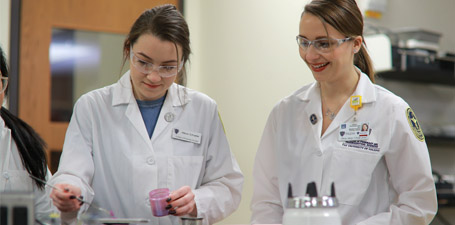 Two students working in a lab