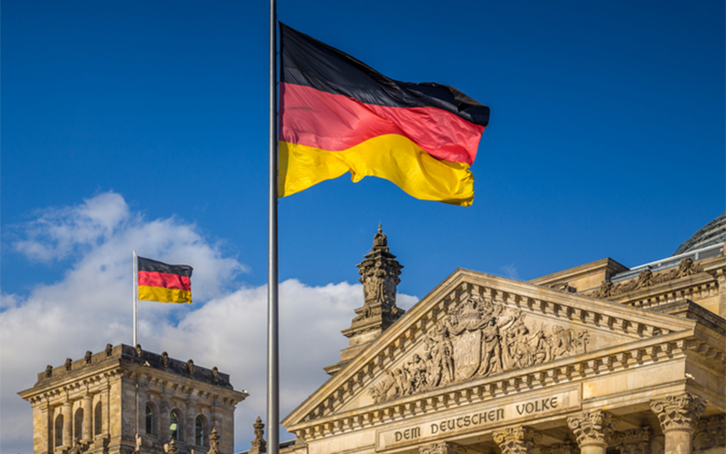 Flag pole with a German Flag waving in the wind