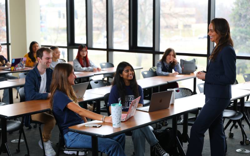 professor leads a lecture to a class in the UToledo Savage Business Complex