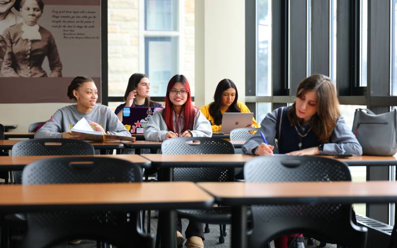 students seated at tables in a UToledo Savage Complex lecture room