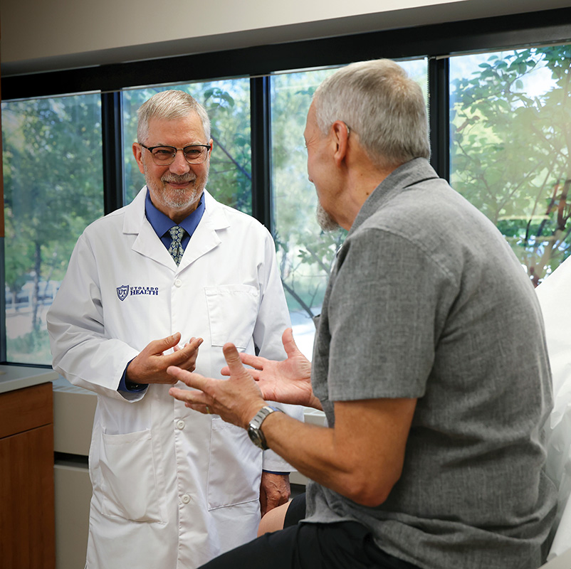 Dr. Blair Grubb with a patient