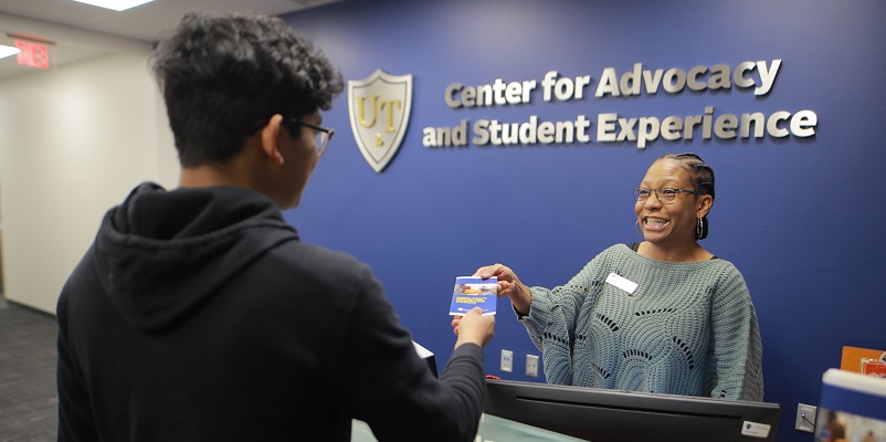 student meeting with a staff member