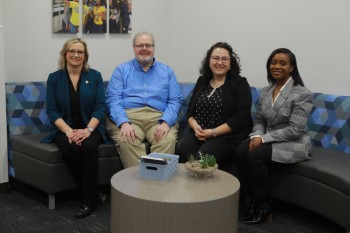 CASE staff group photo on couch