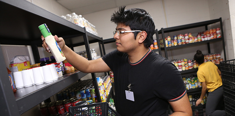 student in food pantry