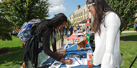 Student registering at involvement fair