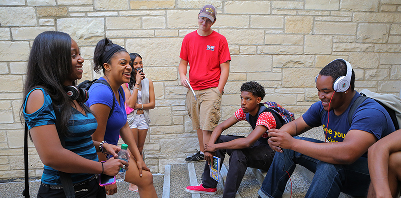 student meeting with a staff memberStudents talking on footsteps