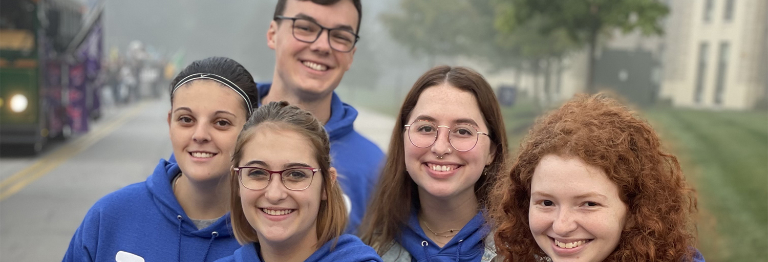 Multiple people posing for the camera in Toledo Hillel hoodies