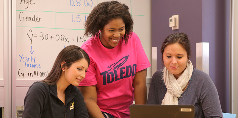 students working on a computer together