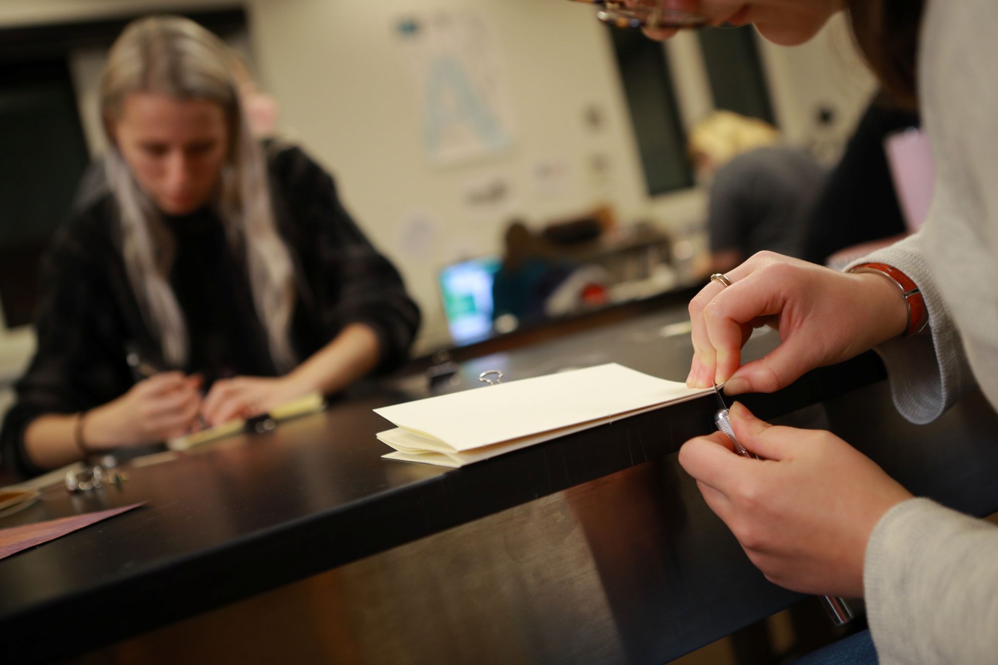 Mother and daughter participating in the "Paint a Pot" during 2023 Mom's Weekend
