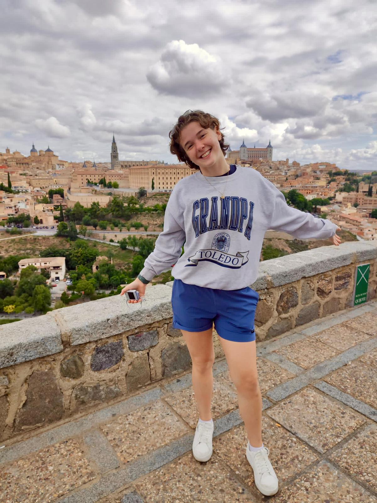 a student standing with an italian background during study abroad