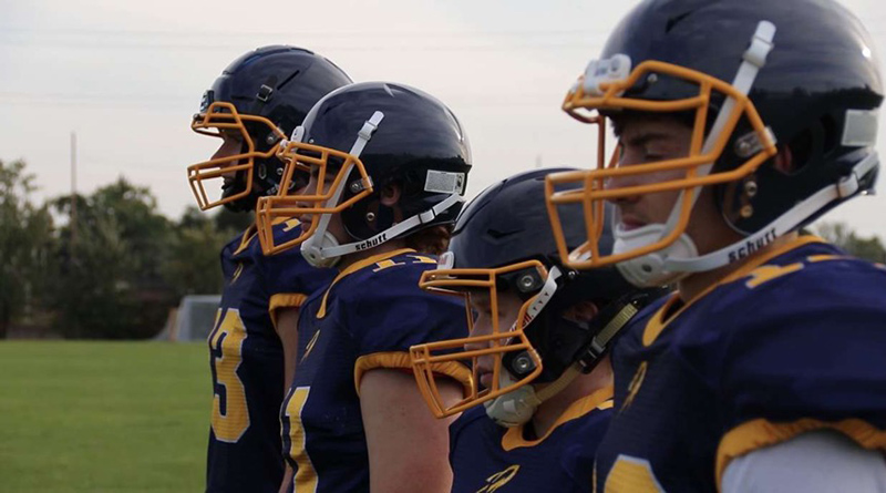 football players lined up on the field