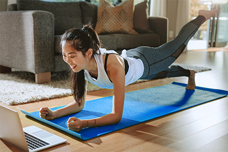 a woman following a virtual fitness class