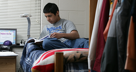 student reading in room