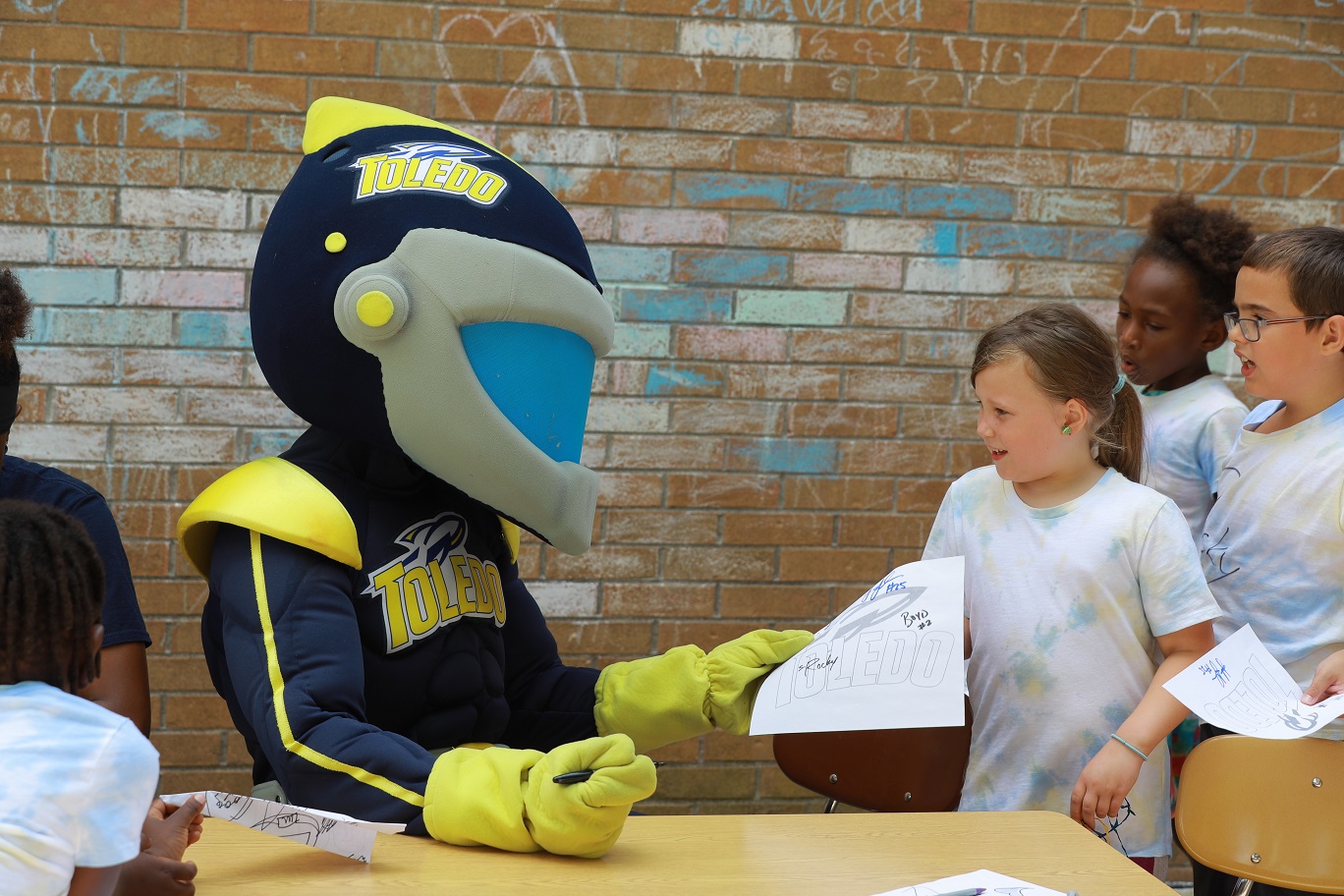 Rocky signs autographs