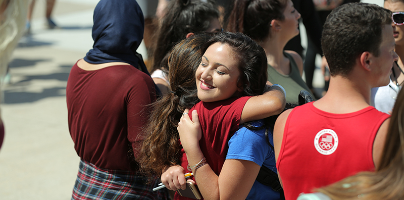 two young women hugging