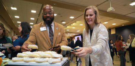 Guests of the State of the University Address select dessert from an array of options