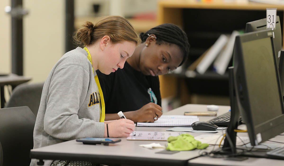 Students writing a paper