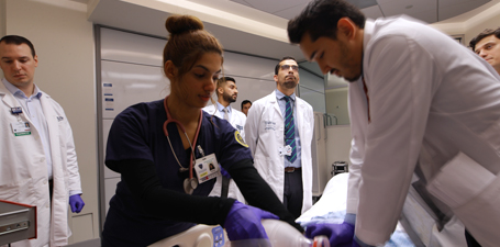 Students practicing on a medical dummy