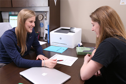 Mentor assisting a student