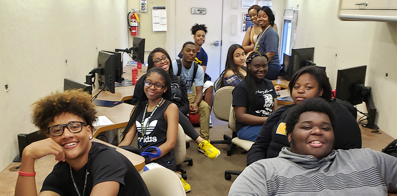 UBMS students in front of computers