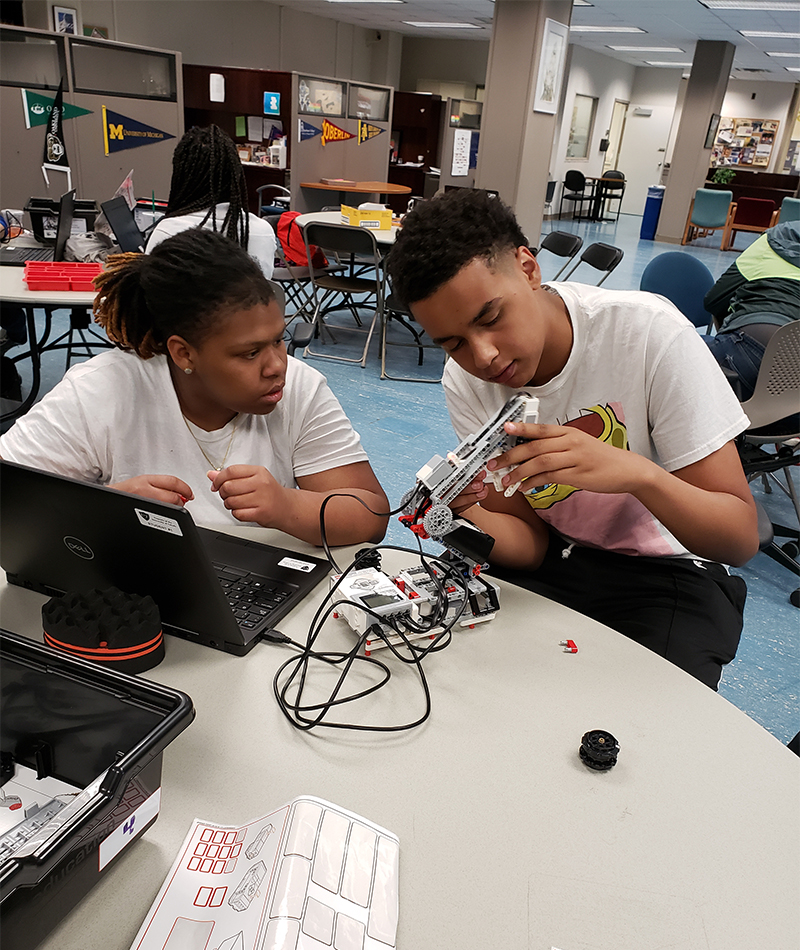 Upward Bound students working on a project