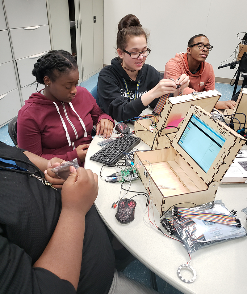 Upward Bound students working on a project